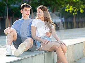 Young man is hugging his girlfriend