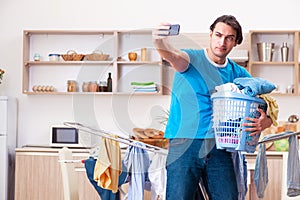 Young man husband doing clothing ironing at home