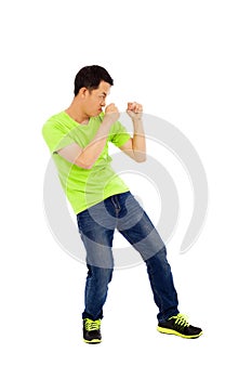Young man imitate boxing ready pose