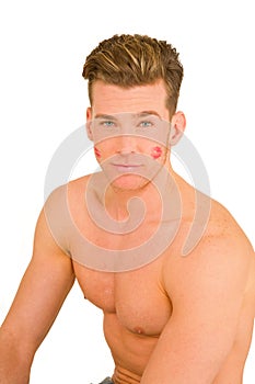 Young man with the imprint of a kiss on the face