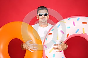 Young man with inflatable ring