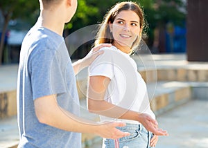 Young man is initiating a conversation with girl