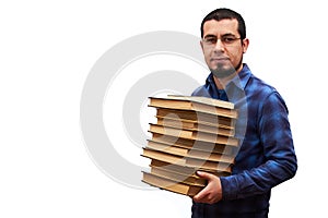 Young man with an intellectual aspect transferring books from a library