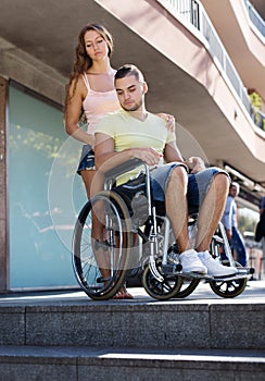 Young man on invalid chair