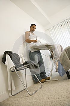 Young Man Ironing