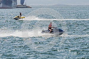 Young man on a jet ski on the sea
