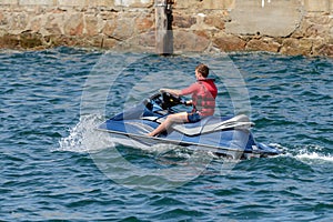 Young man on a jet ski on the sea