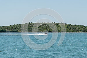 Young Man on Jet Ski, Tropical Ocean, Vacation Concept