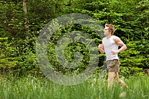 Young man jogging in nature