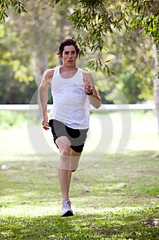 Young Man Jogging in Park