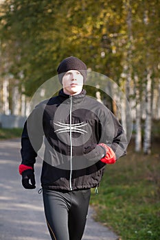 Young man jogging in park