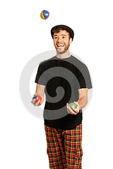 Young man juggling isolated on white background