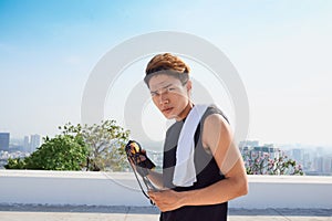 Young man jump roping in the outdoors.