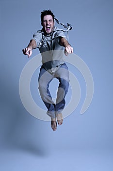 Young man jumping in excitement photo