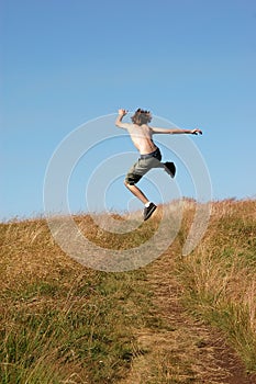 Young man jumping for joy