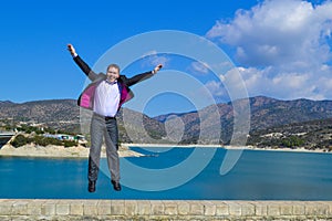 Young man jumping of joy