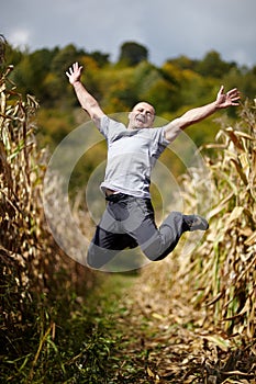 Young man jumping of joy