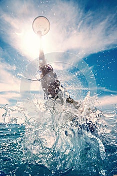 Young man jumping in the water