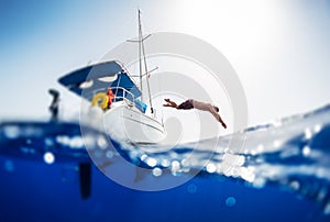 Young man jumps into the sea