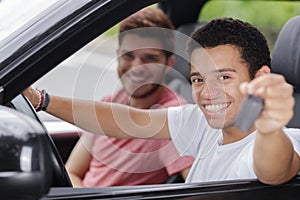 young man with keys to car