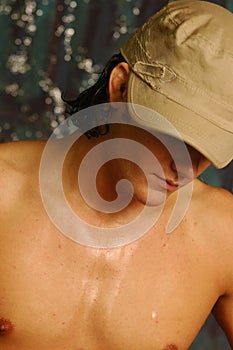 Young man in a khaki hat photo