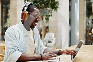 Young man laptop working technology online business person computer earphones office businessman