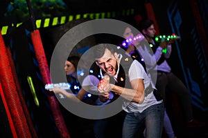 Young man on laser tag arena