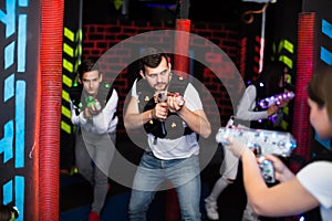 Young man on laser tag arena
