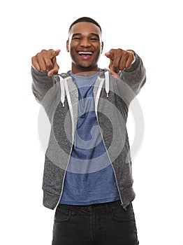 Young man laughing and pointing finger