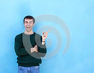Young man laughing and pointing finger