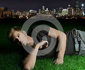 Young man laying on grass