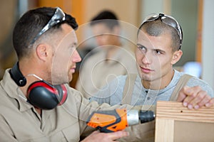 young man learning wood classes