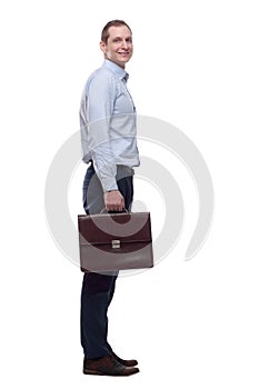 Young man with a leather briefcase looking at you