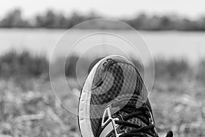 Young man leg shod in running shoes