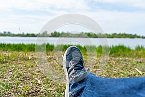 Young man legs shod in running shoes.