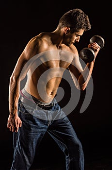 Young Man Lifting Dumbell to Exercise Biceps - Dumbbell Concentration Curl