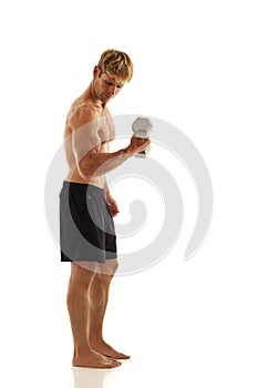 Young man lifting weights