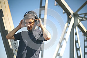 The young man listen to the music from the headphones