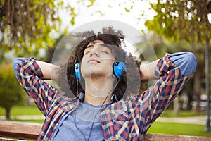 Young man listening music with earphones