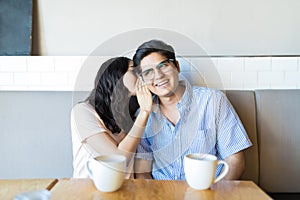 Young Man Listening To Girlfriend Revealing Secrets photo