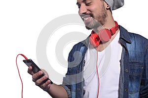 Young man listening to music with smartphone.