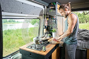 Young man living in a camper van
