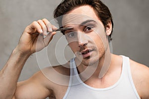 young man looking at camera while