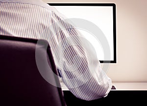 Young man looking at empty computer screen