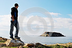 Young man looking at the sea