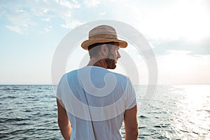 Young man looking into the sea horizon