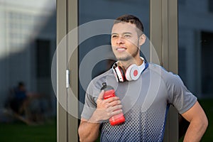 Young man looking up into the future runner outdoor sports fitness training