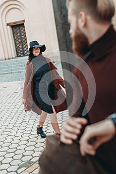 young man looking at woman