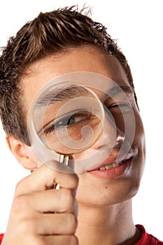 Young man with a magnifying glass