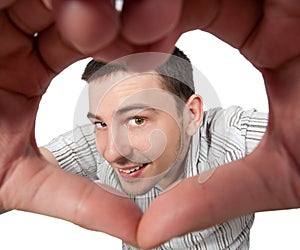 Young man make making heart sign